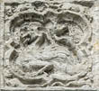 Panel 13:11 - Cockatrice-like monster (quite eroded)